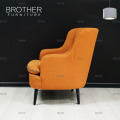 Canapé monoplace orange brillant de style accent de coussin lumineux